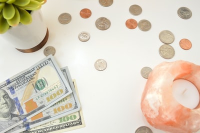 White round silver COINS on the table
